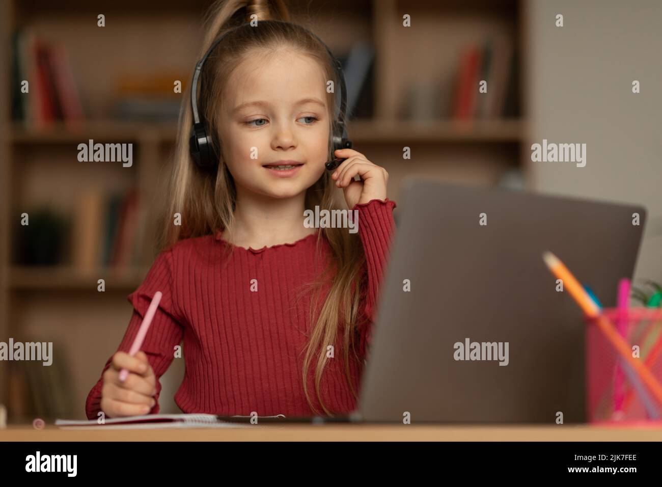 School Girl Learning Using Laptop Making Video Call At Home Stock Photo ...