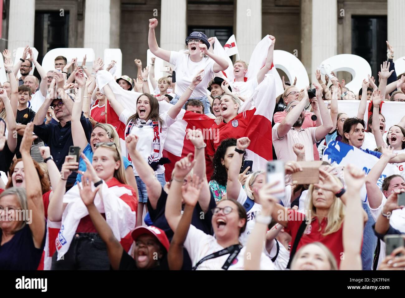 Fans in Trafalgar Square, London, celebrate England winning after watching the screening of the UEFA Women's Euro 2022 final held at Wembley Stadium, London. Picture date: Sunday July 31, 2022. Stock Photo