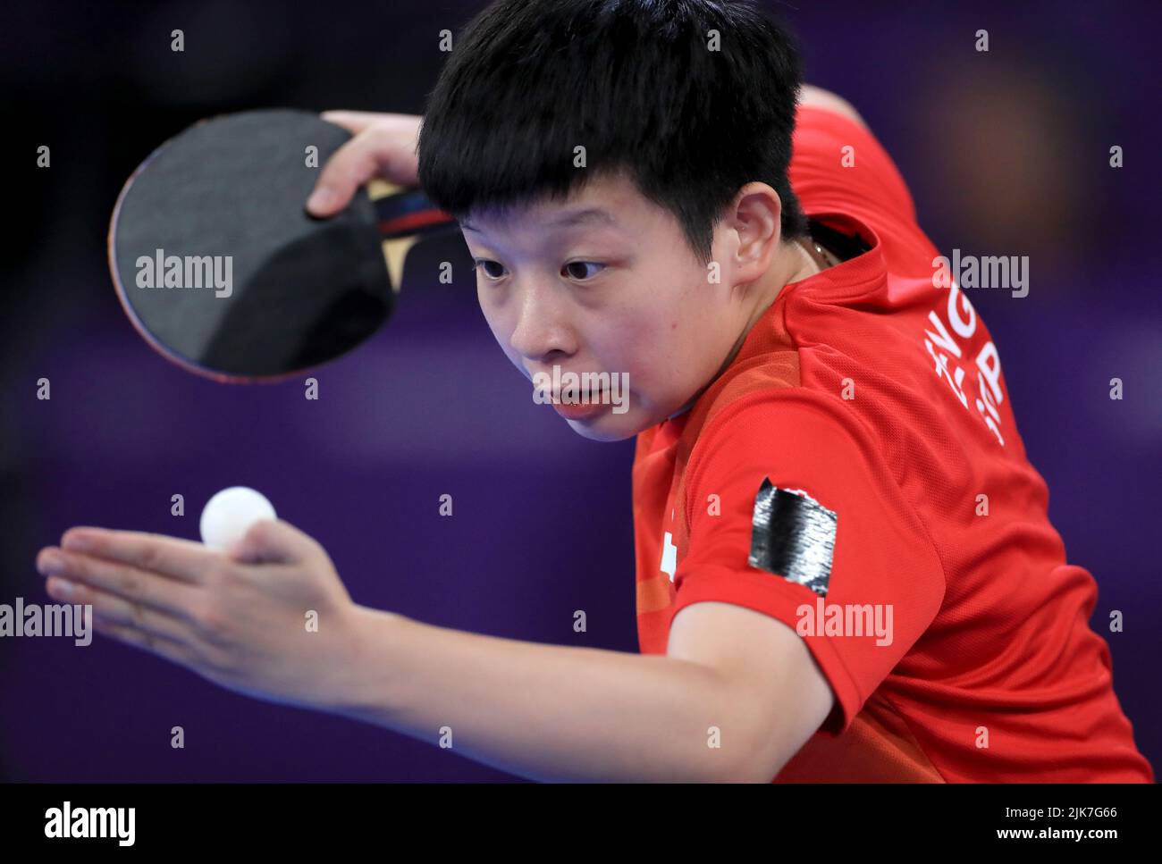 Singapore’s Jian Zeng serves with partner (out of frame) Jingyi Zhou