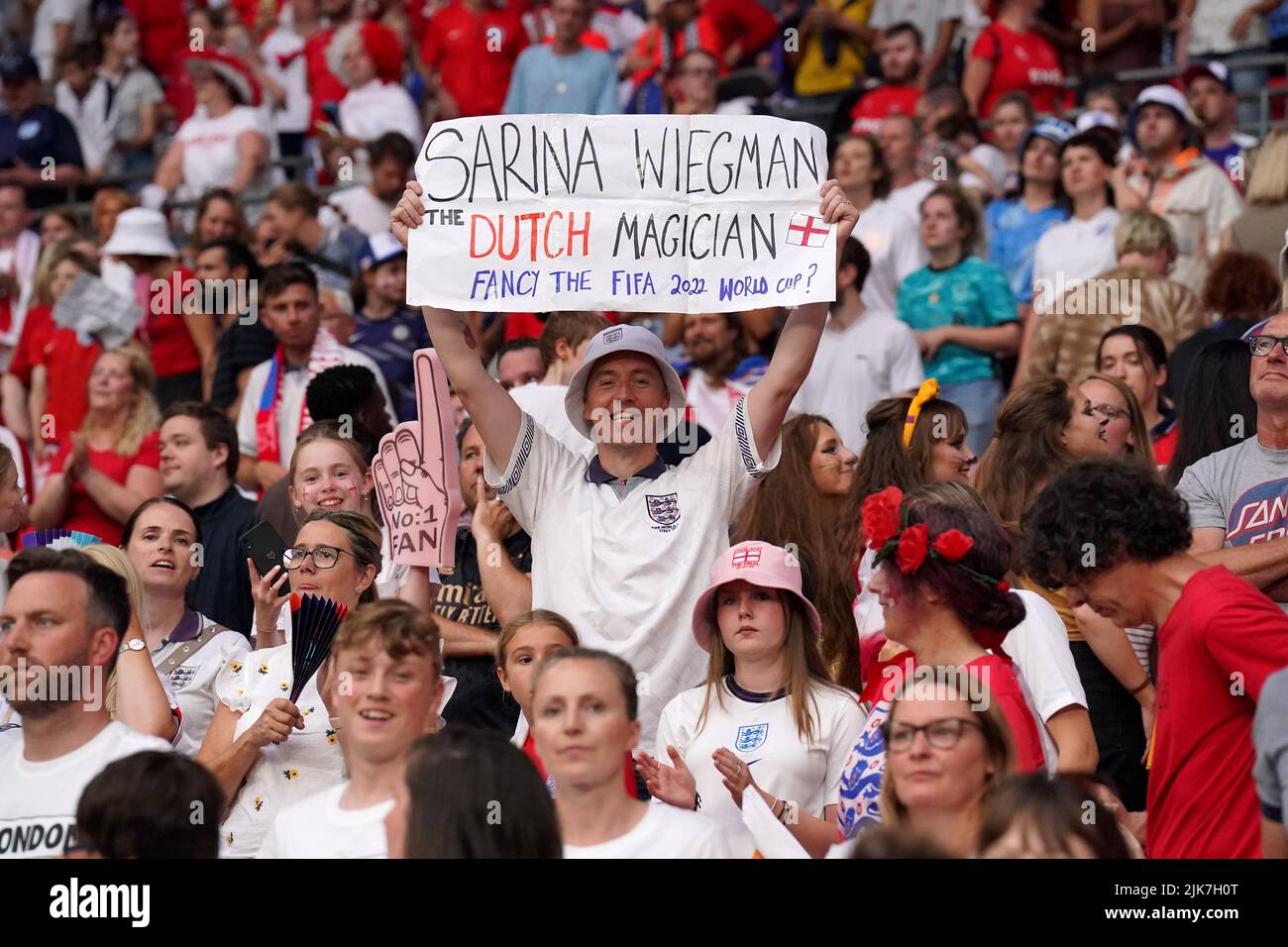 An England fan holds a 'Sarina Wiegman The Dutch Magician' sign in the stands as England celebrate winning the UEFA Women's Euro 2022 final at Wembley Stadium, London. Picture date: Sunday July 31, 2022. Stock Photo