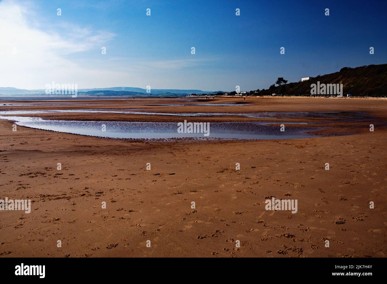 Pools of seawater at Exmouth beach with the tide out. Stock Photo