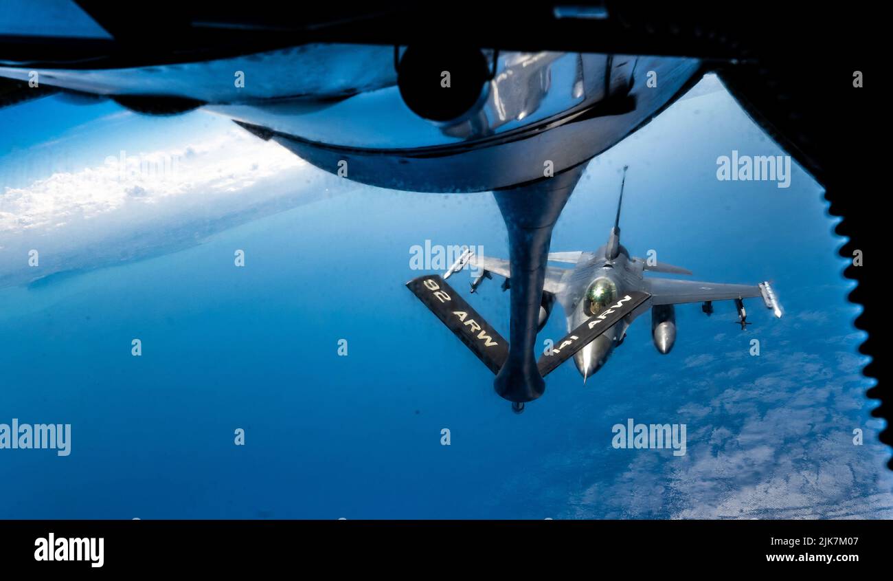 Adriatic Sea, Italy. 28 July, 2022. A U.S. Air Force F-16 Fighting Falcon fighter jet, assigned to the 31st Fighter Wing, approaches a KC-135 Stratotanker refueling aircraft during a NATO training mission, July 28, 2022 over the Adriatic Sea.  Credit: SSgt Kevin Long/U.S. Air Force/Alamy Live News Stock Photo