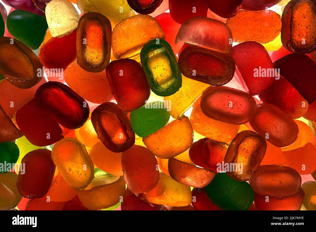 Candy pattern. silhouette of many multi colored yummy bright candies in different shapes. Stock Photo