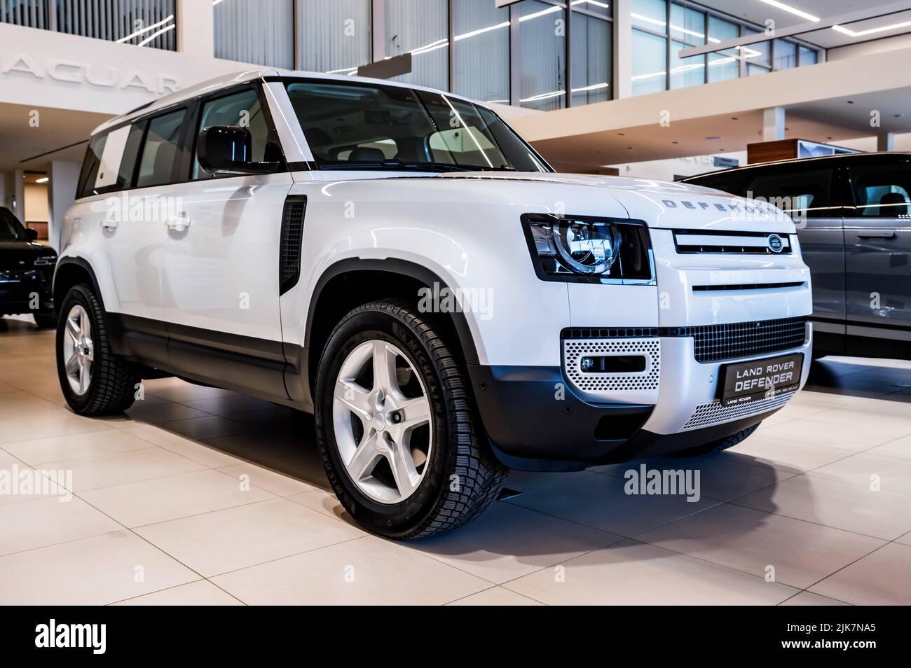 ROSTOV-ON-DON, RUSSIA - 7 DECEMBER 2020: Land Rover Defender, new popular model in dealer centre, front side view. Selective focus Stock Photo