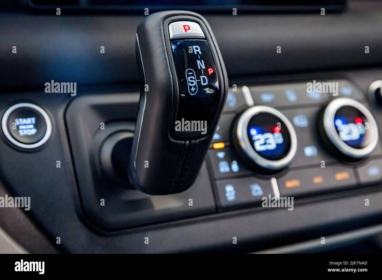 ROSTOV-ON-DON, RUSSIA - 7 DECEMBER 2020: close up of automatic transmission stick and control panel in new Land Rover Defender. Selective focus Stock Photo