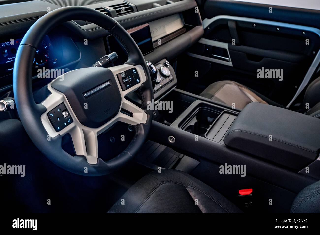 ROSTOV-ON-DON, RUSSIA - 7 DECEMBER 2020: Land Rover Defender, new popular model in dealer centre, view on Dash board and steering wheel. Selective foc Stock Photo