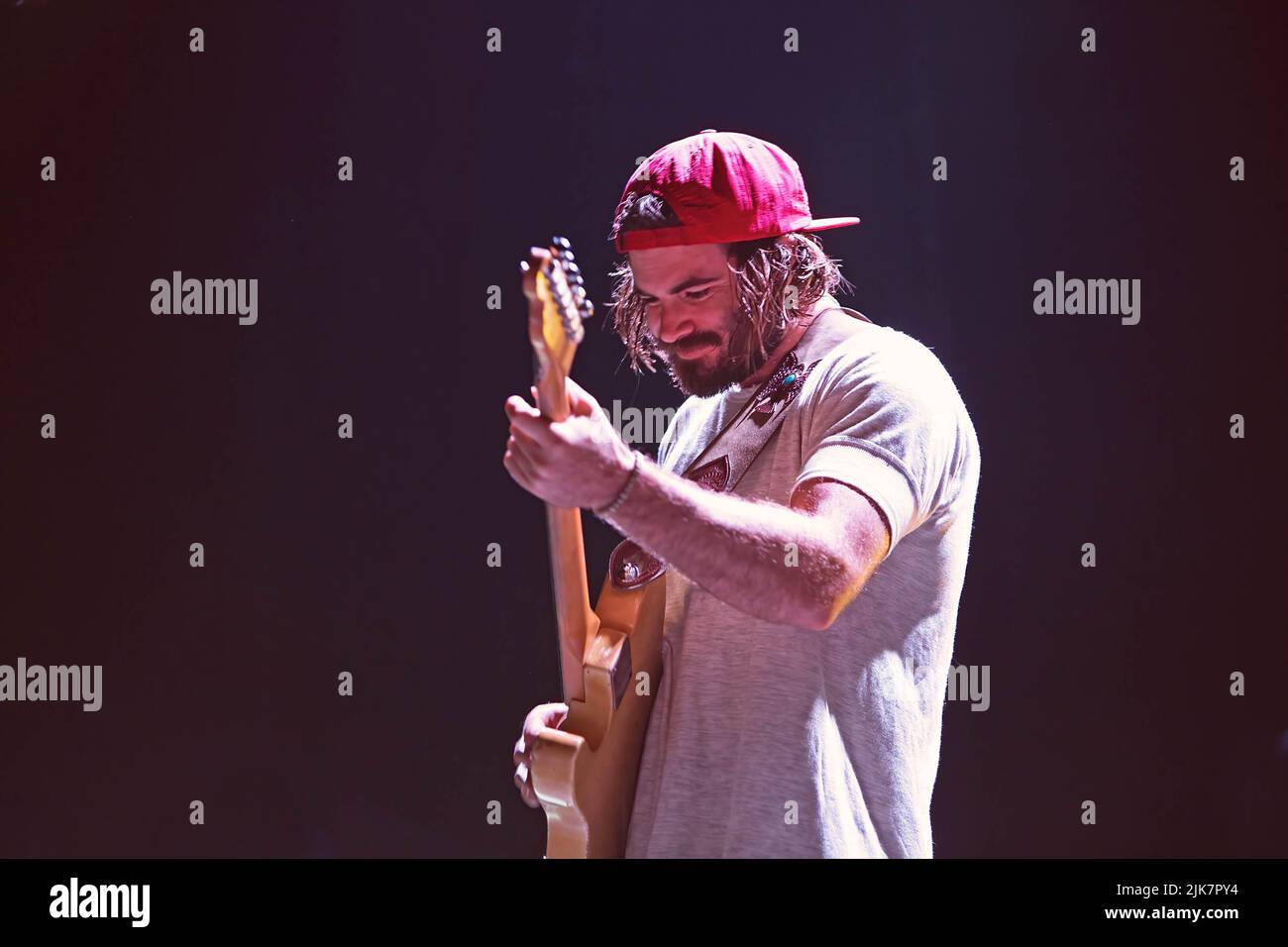Angus of Angus and Julia Stone performs on stage with his sister at