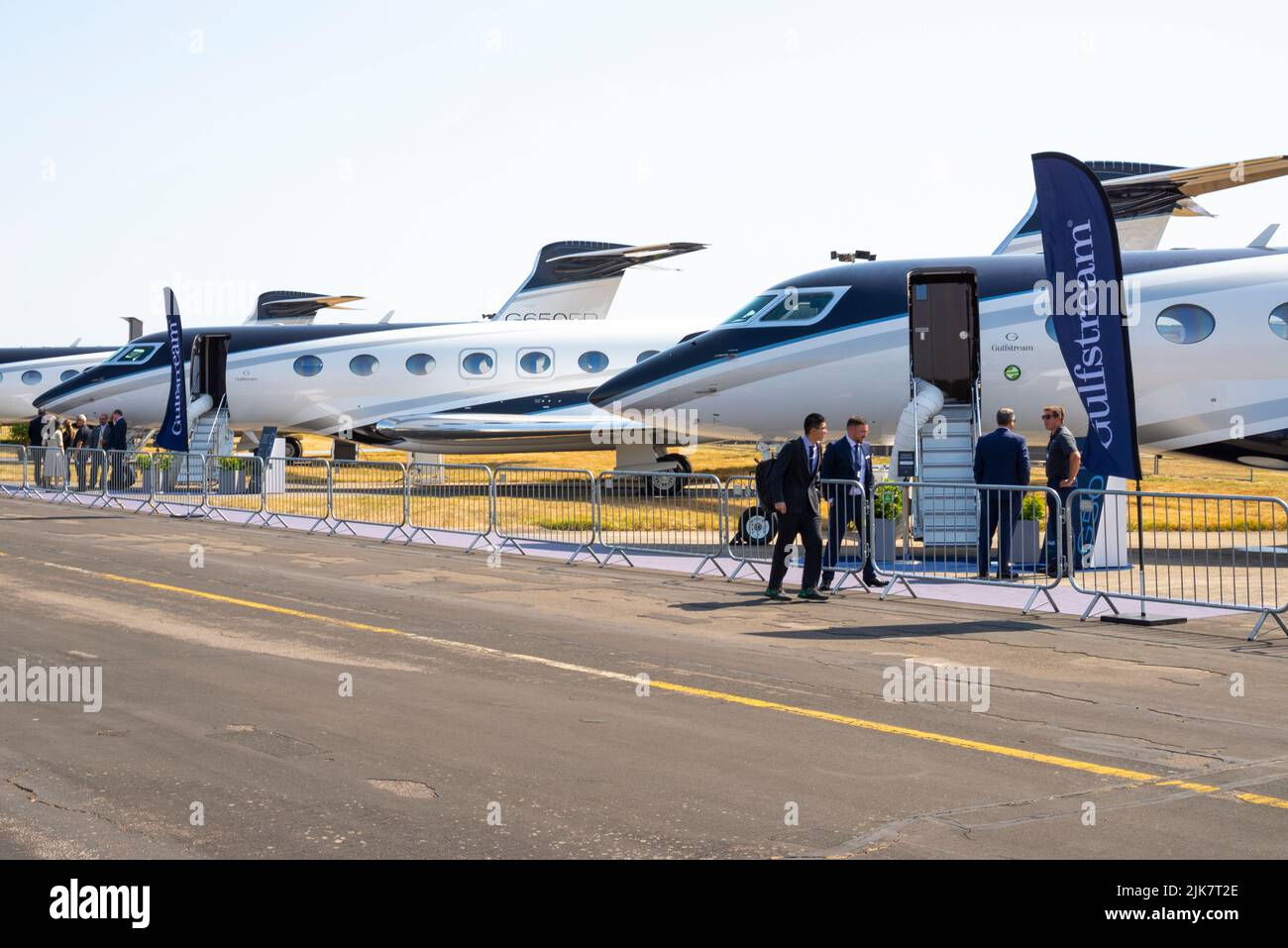 Gulfstream Aerospace corporate jet planes on show at Farnborough International Airshow 2022. Executive jet airplanes on display with representatives Stock Photo