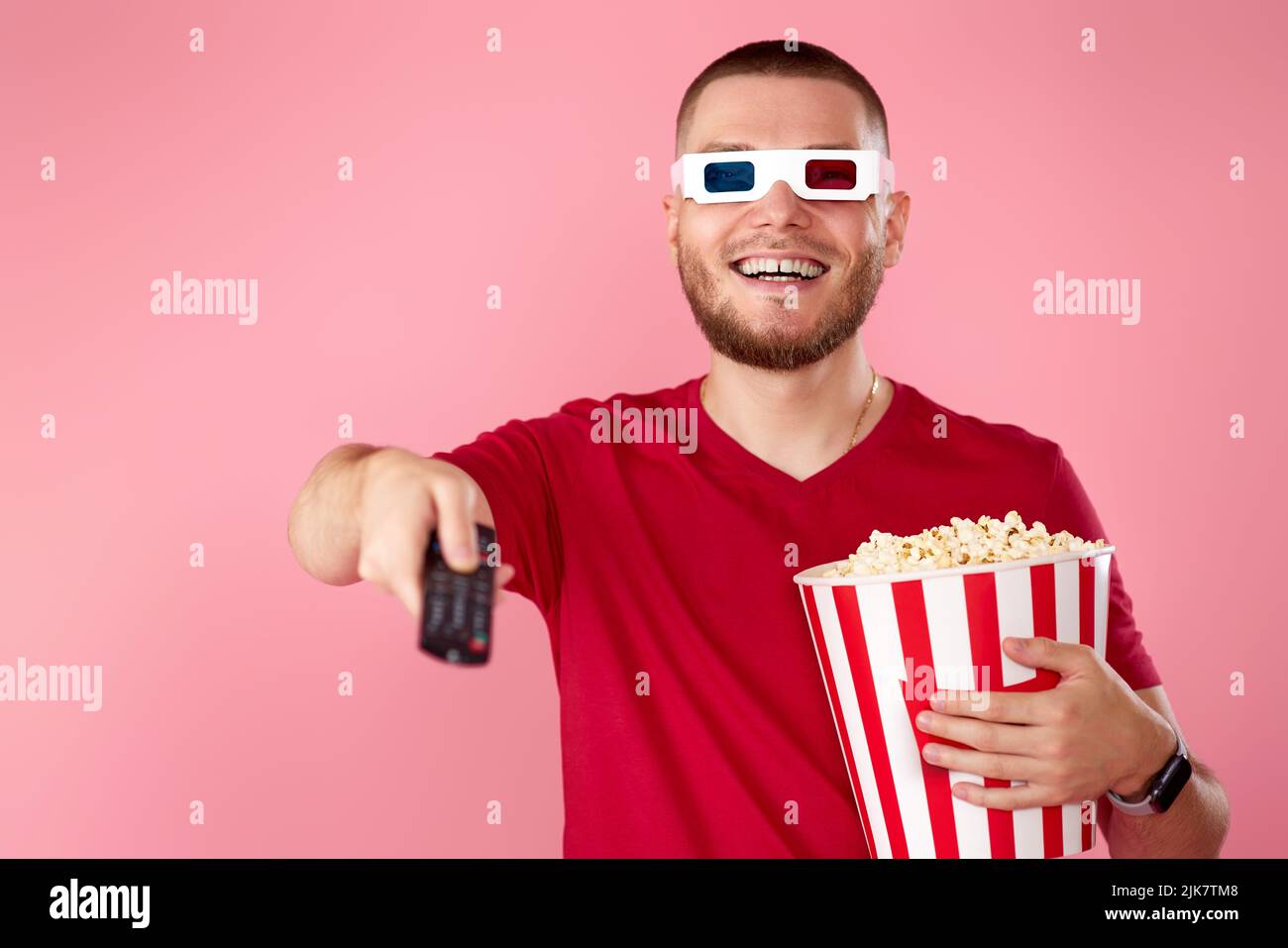 man in 3d glasses using console watching movie Stock Photo
