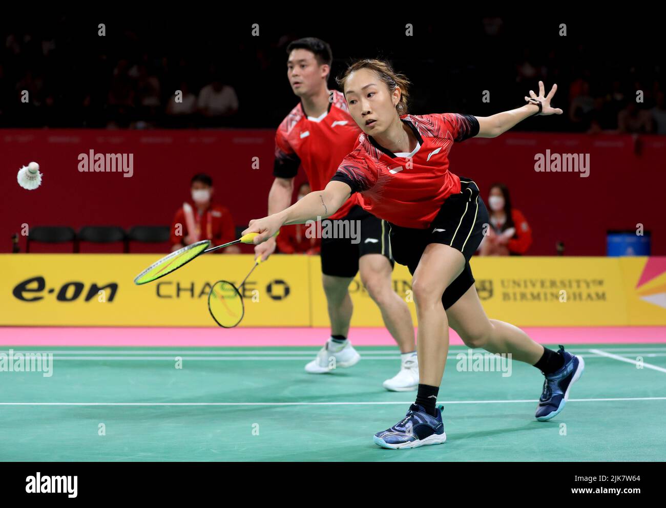 Singapore’s Jessica Wei Han in action with Yong Kai Terry Hee against Scotland’s Adam Hall and Julie Macpherson during the Badminton Mixed Doubles, Mixed Team Quarter-Final between Team Scotland and Team Singapore at The NEC on day three of the 2022 Commonwealth Games in Birmingham. Picture date: Sunday July 31, 2022. Stock Photo