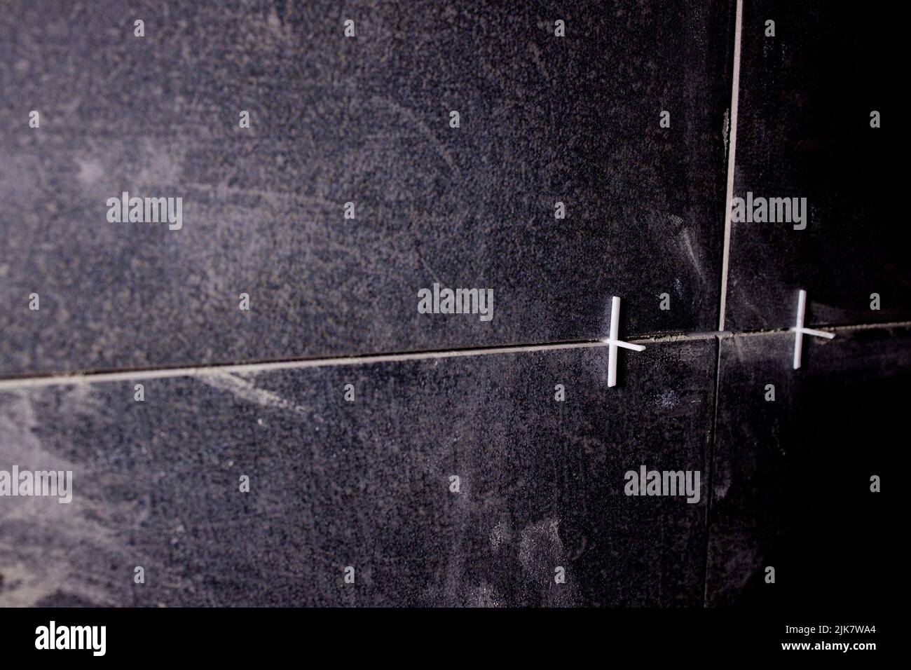 Laying ceramic tiles on a special cement mortar with the help of