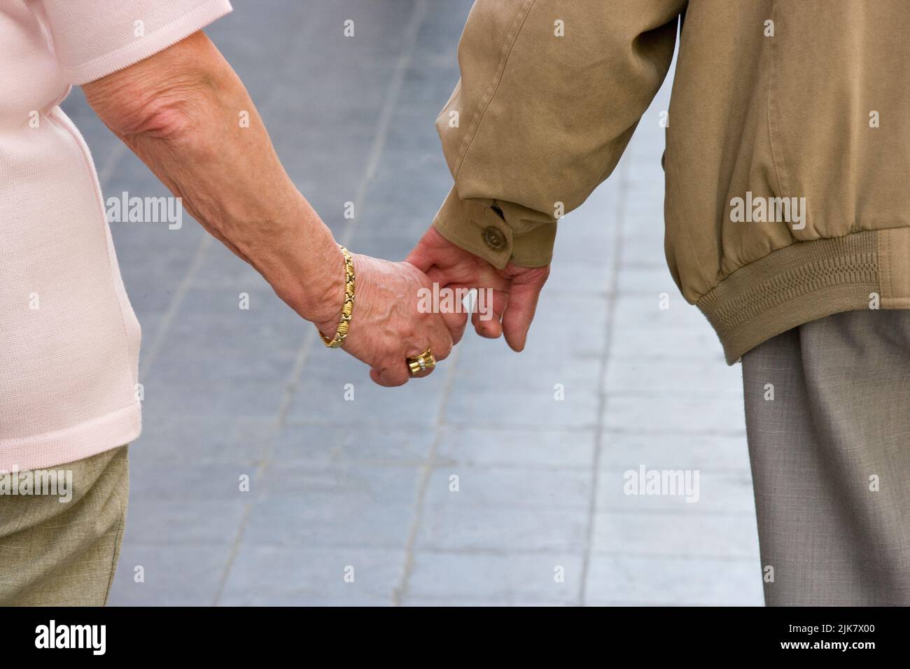 seniors holding hands Stock Photo