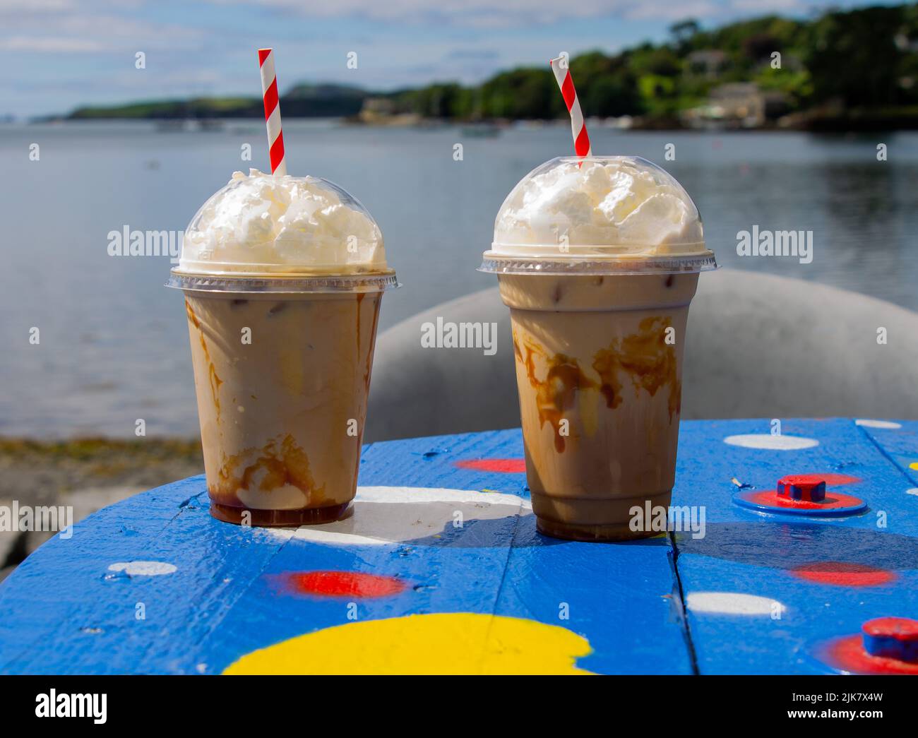 Iced Caramel Coffee with cream on top hot summers day. Stock Photo