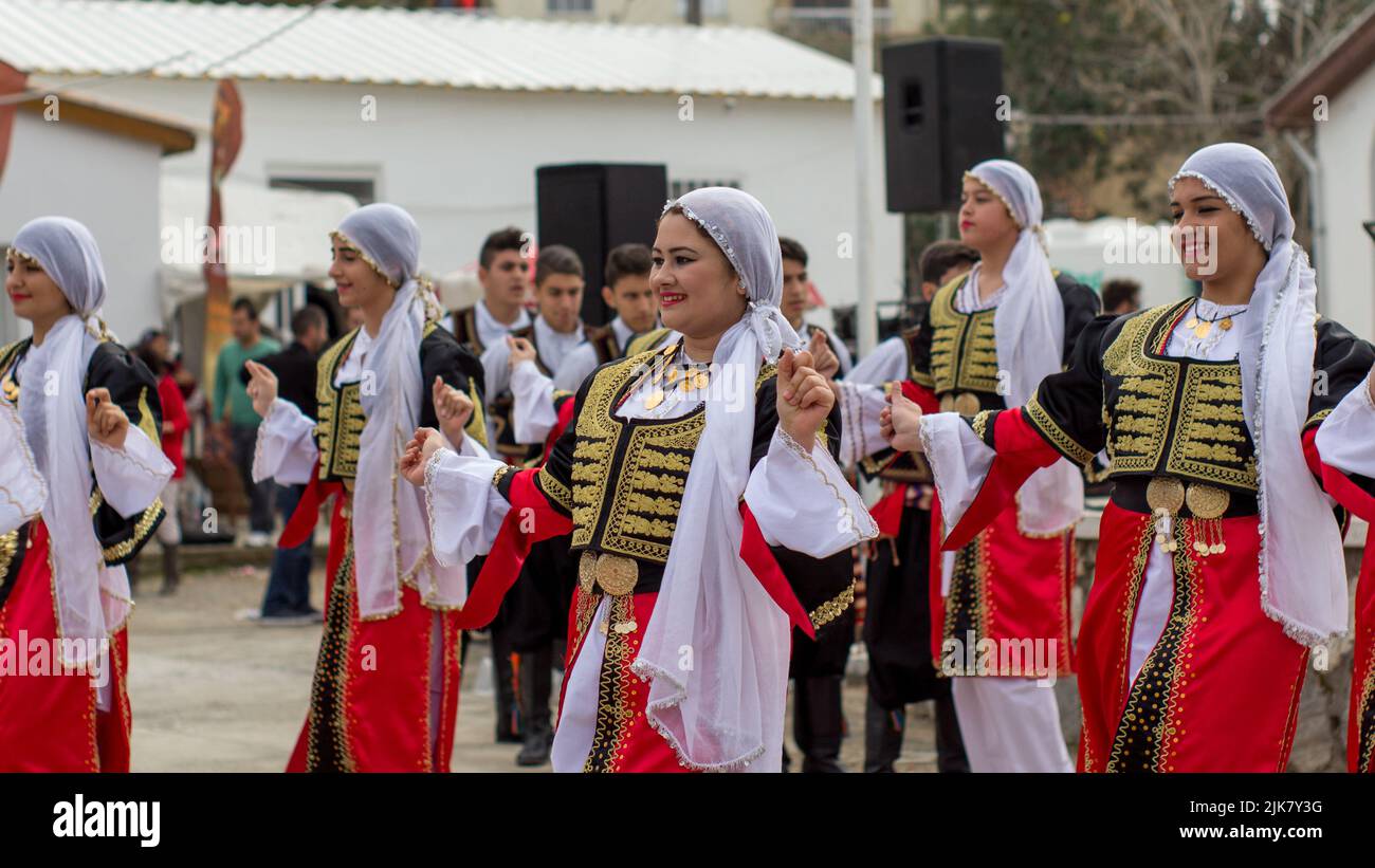 Turkish Cypriot female dancers in traditional costumes perform a dance routine at the Tepebasi tulip festival (Lale Festivali) in North Cyprus Stock Photo