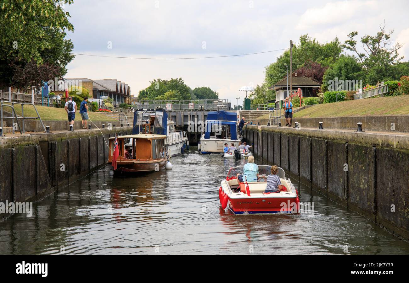 People in boats tied up inside Molesey lock on the River Thames in the summer Stock Photo