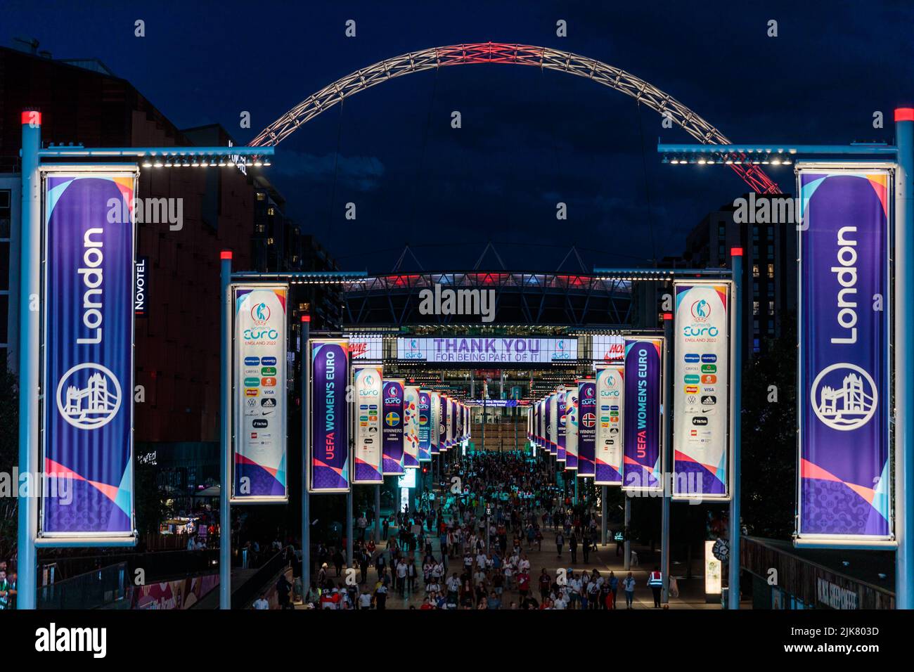 Wembley Stadium, London,UK. 31st July 2022.Atmosphere outside Wembley Stadium following England's Lionesses history victory over Germany in the Women's UEFA Euro Final. Wembley Stadium arch lit the colours of the England Flag, the St Georges Cross. Amanda Rose/Alamy Live News Stock Photo