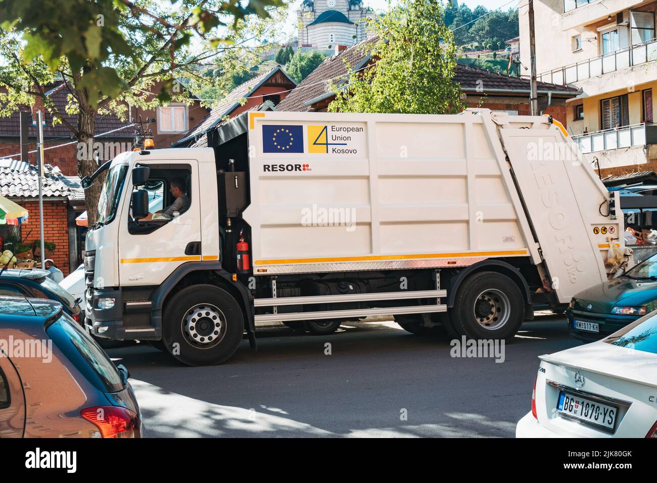 a European Union sponsored rubbish truck collects waste from the streets of North Kosovska Mitrovica, Kosovo Stock Photo