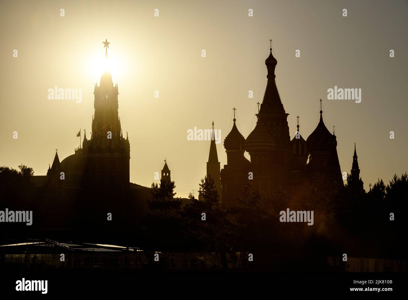 Moscow Kremlin and St Basil's Cathedral view, Russia. Scenery of Moscow city center and sun in summer. Silhouettes of Moscow landmarks in sunlight. To Stock Photo