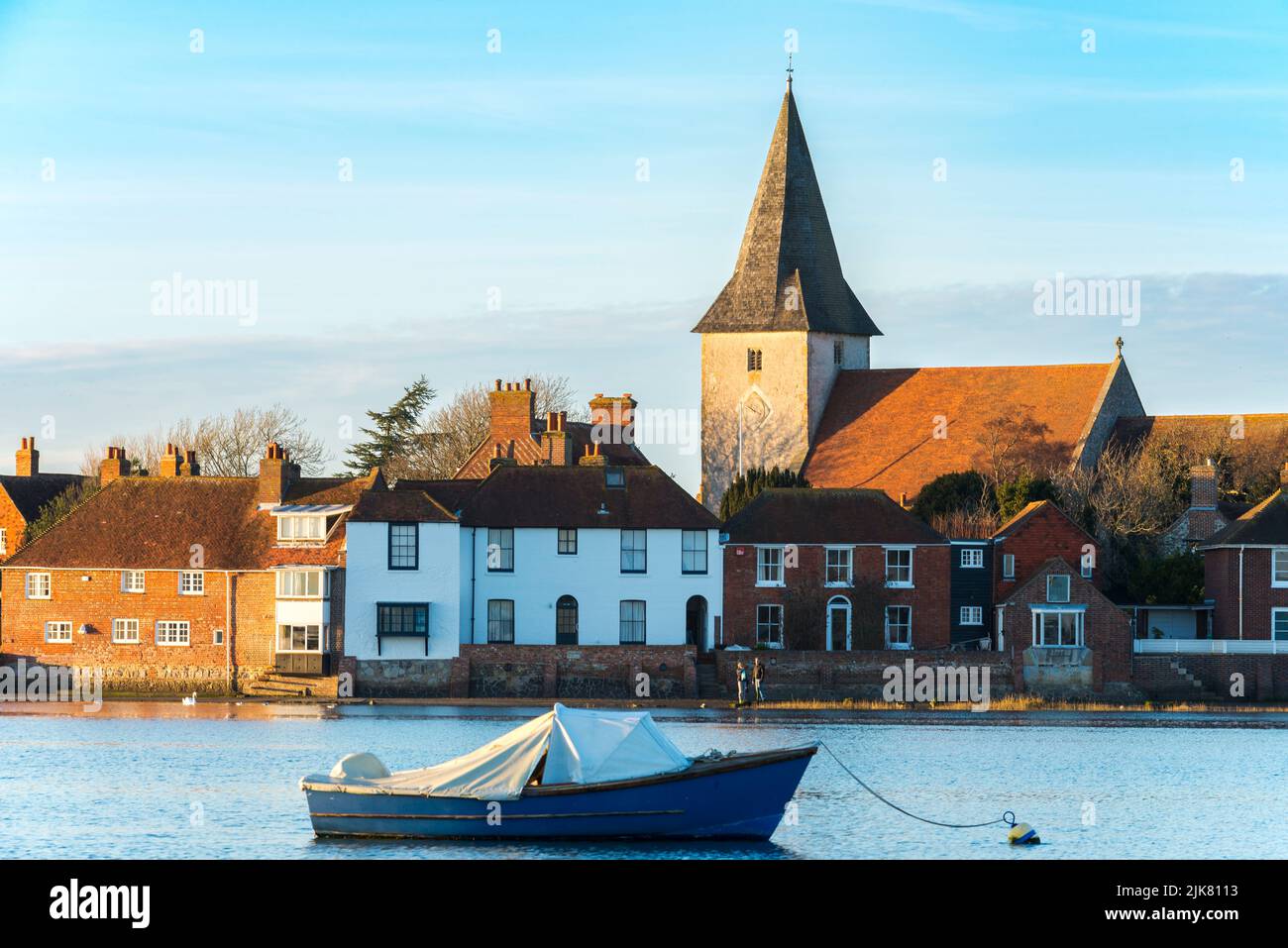 Bosham village viewed across the harbour on a sunny winter afternoon, Bosham, West Sussex, England Stock Photo