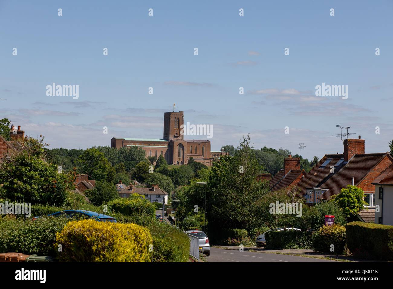 Guildford, UK  June 20th 2022  Guildford Cathedral exterior and surrounding houses, seen from an elevated view Stock Photo
