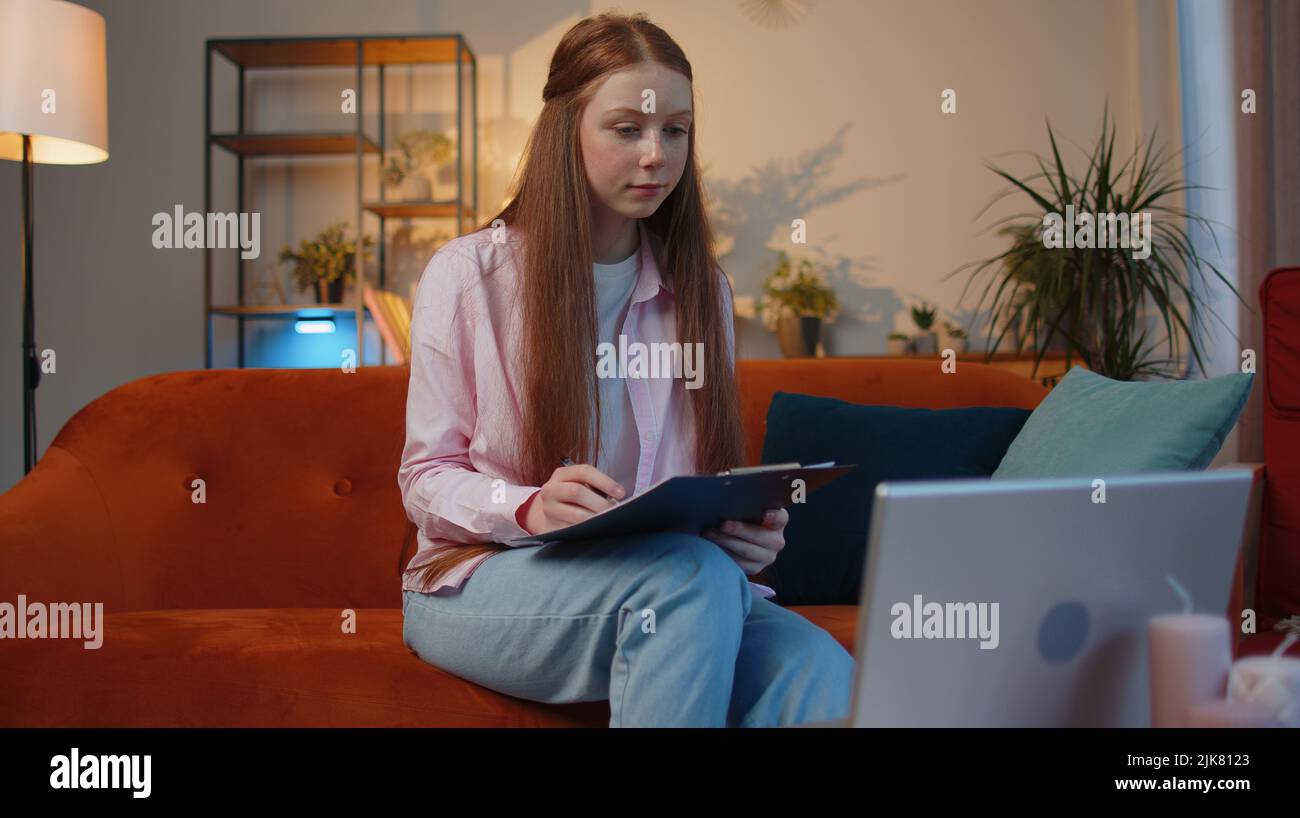 Happy smiling young child girl accounting payments and calculating