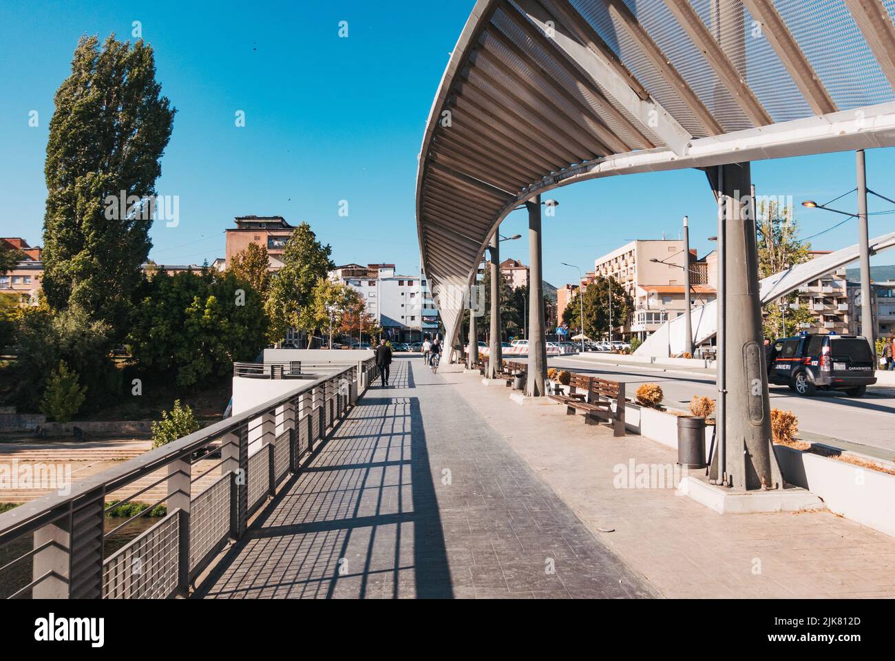 a sidewalk on the New Bridge in Mitrovica, Kosovo. The bridge connects the city's Serb north with the Kosovar south and has seen historical tensions Stock Photo