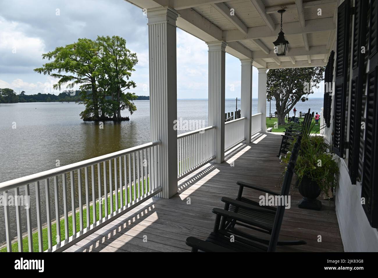 Guest porch with rocking chairs at the Barker House overlooking Edenton Bay on the waterfront of Edenton, North Carolina. Stock Photo
