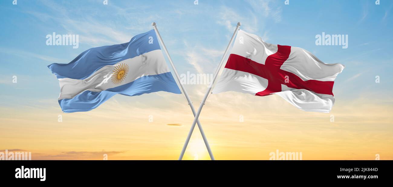 crossed national flags of Argentine and England flag waving in wind at ...