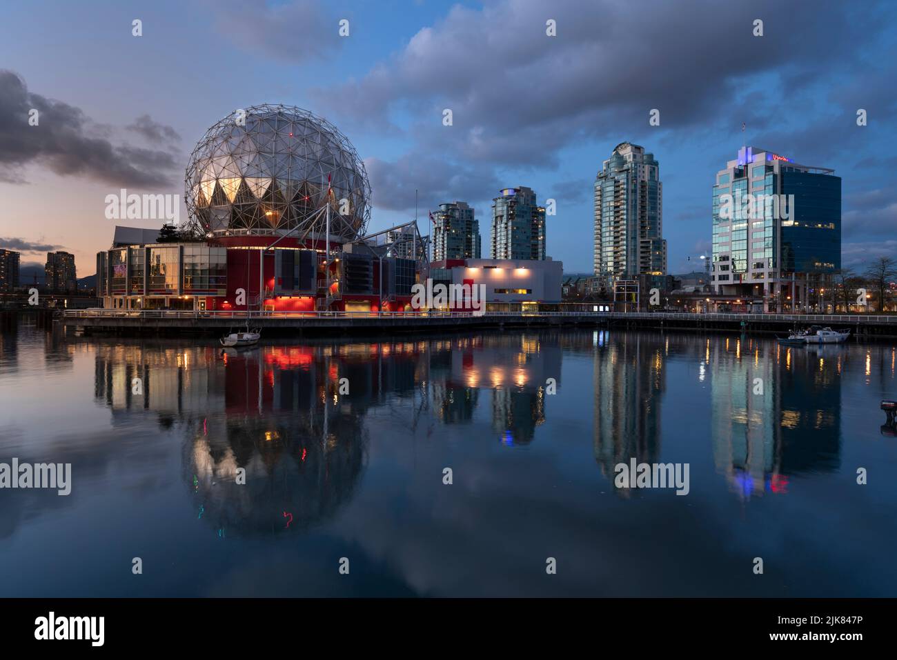 The Science World dome at night with reflections in False Creek in