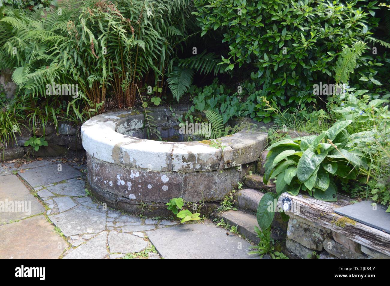 A water well in the garden of preserved 19th century Hugh Millar's Cottage at Cromarty. Stock Photo