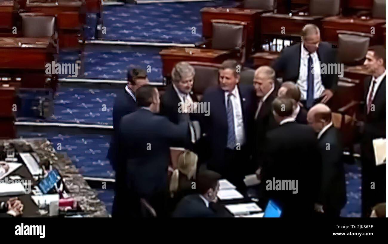 US Republican Senators created national outrage when they bumped fists after voting to hold up aid bound for military veterans suffering from burn-pit exposure.  US Sen. Ted Cruz (R-TX) was captured on CSPAN video Thursday fist-bumping US Sen. Steve Daines (R-MT.) when Republicans blocked the PACT Act, which would allow soldiers, sailors and airmen exposed to burn pits of smoldering toxic waste in combat zones to be covered by the Veterans Affairs health care system for such illnesses as cancer. (Screenshot from CSPAN) Stock Photo