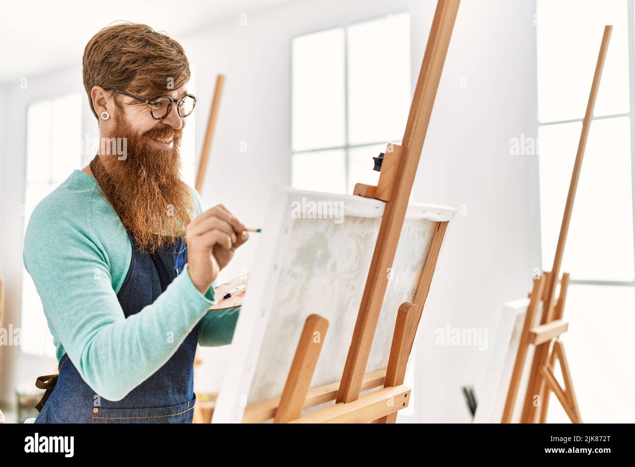 Smiling redhead man painting hi-res stock photography and images - Alamy