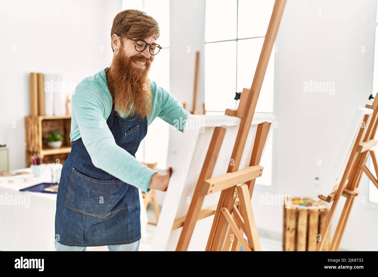 Smiling redhead man painting hi-res stock photography and images - Alamy