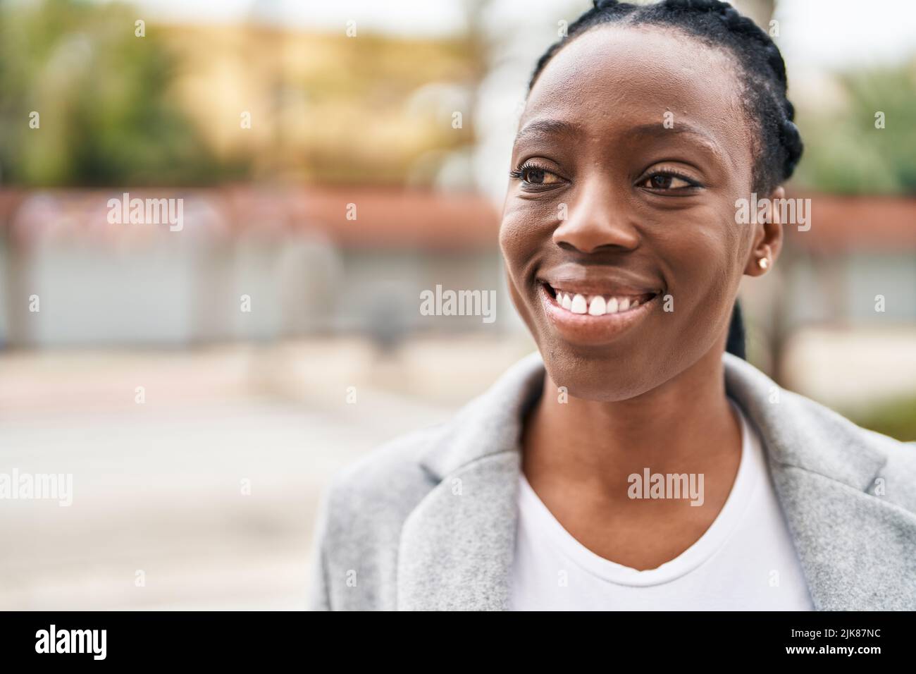 African american woman smiling confident looking to the side at street ...