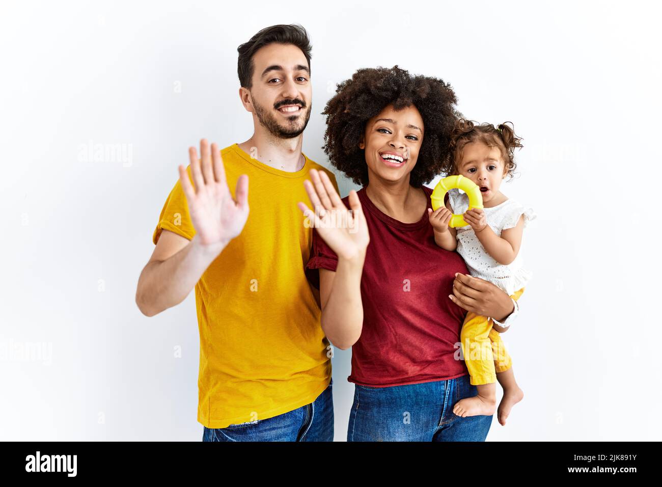 Interracial young family of black mother and hispanic father with ...