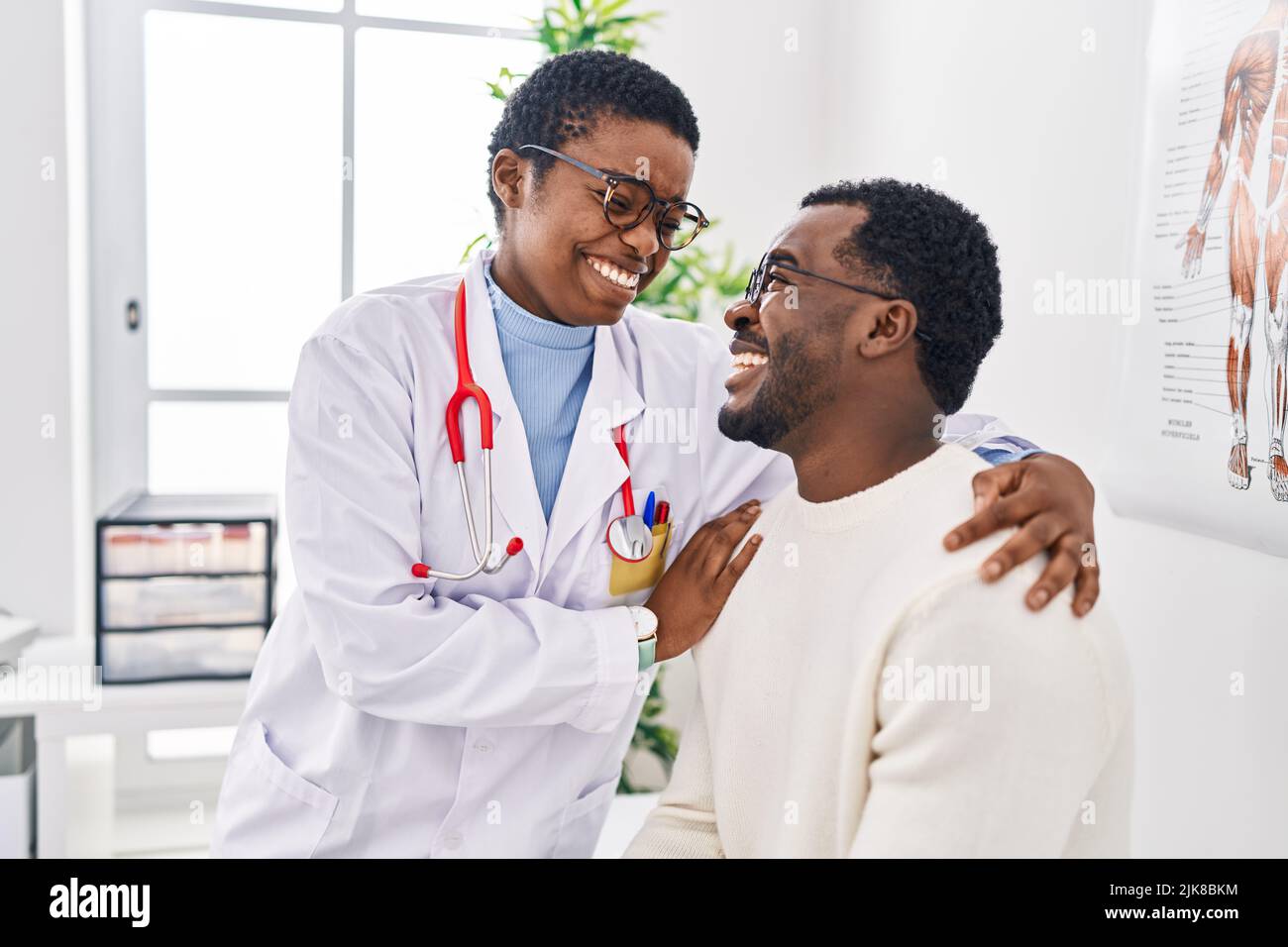 Man And Woman Doctor And Patient Having Medical Consultation Hugging Each Other At Clinic Stock 1513