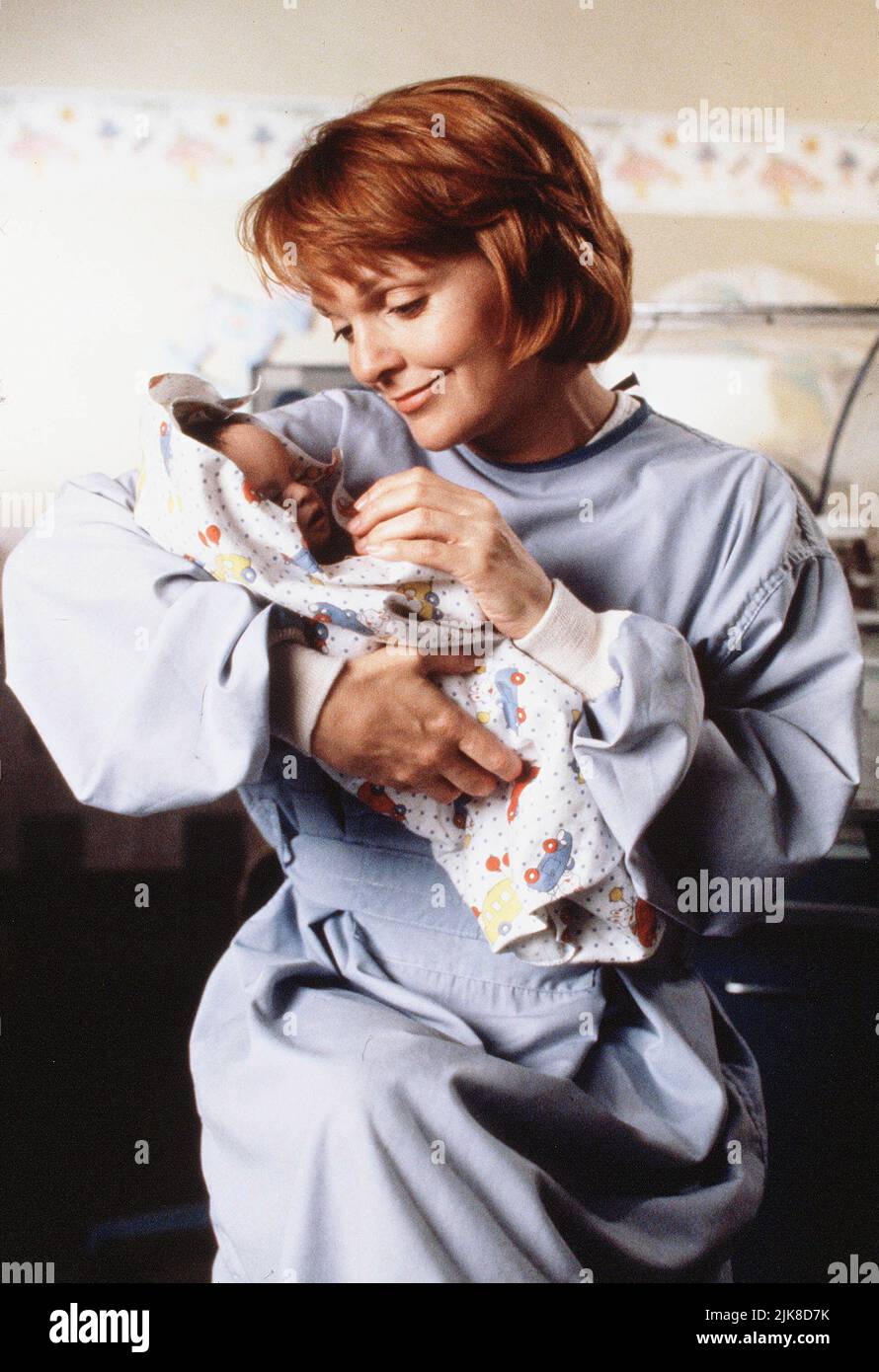 Pamela Reed & Baby Film: Born Too Soon (1992) Characters: Elizabeth Mehren &  Director: Noel Nosseck 25 April 1993   **WARNING** This Photograph is for editorial use only and is the copyright of NBC and/or the Photographer assigned by the Film or Production Company and can only be reproduced by publications in conjunction with the promotion of the above Film. A Mandatory Credit To NBC is required. The Photographer should also be credited when known. No commercial use can be granted without written authority from the Film Company. Stock Photo
