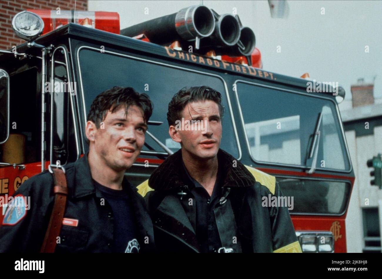 Jason Gedrick & William Baldwin Film: Backdraft (1991) Characters: Tim Krizminski & Brian McCaffrey  Director: Ron Howard 24 May 1991   **WARNING** This Photograph is for editorial use only and is the copyright of UNIVERSAL and/or the Photographer assigned by the Film or Production Company and can only be reproduced by publications in conjunction with the promotion of the above Film. A Mandatory Credit To UNIVERSAL is required. The Photographer should also be credited when known. No commercial use can be granted without written authority from the Film Company. Stock Photo