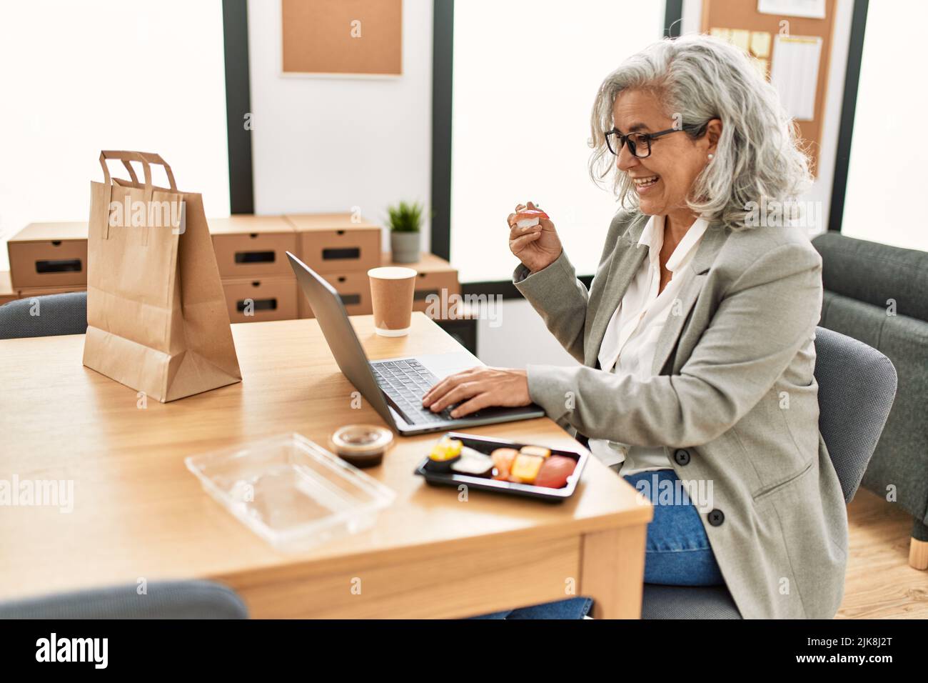 Happy mature woman eating rice hi-res stock photography and images - Alamy