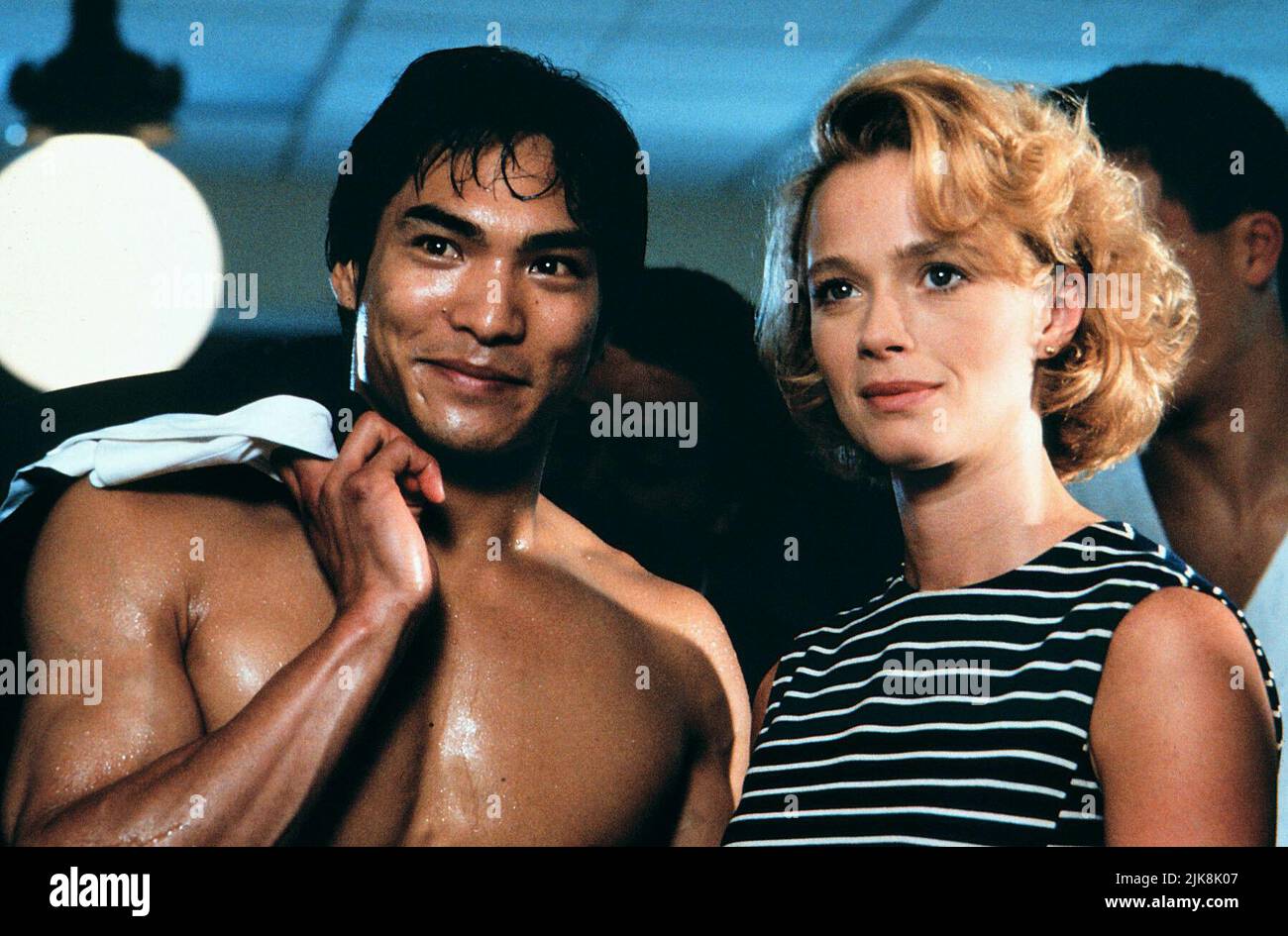 Jason Scott Lee & Lauren Holly Film: Dragon: The Bruce Lee Story (1993) Characters: Bruce Lee & Linda Lee  Director: Rob Cohen 07 May 1993   **WARNING** This Photograph is for editorial use only and is the copyright of UNIVERSAL and/or the Photographer assigned by the Film or Production Company and can only be reproduced by publications in conjunction with the promotion of the above Film. A Mandatory Credit To UNIVERSAL is required. The Photographer should also be credited when known. No commercial use can be granted without written authority from the Film Company. Stock Photo