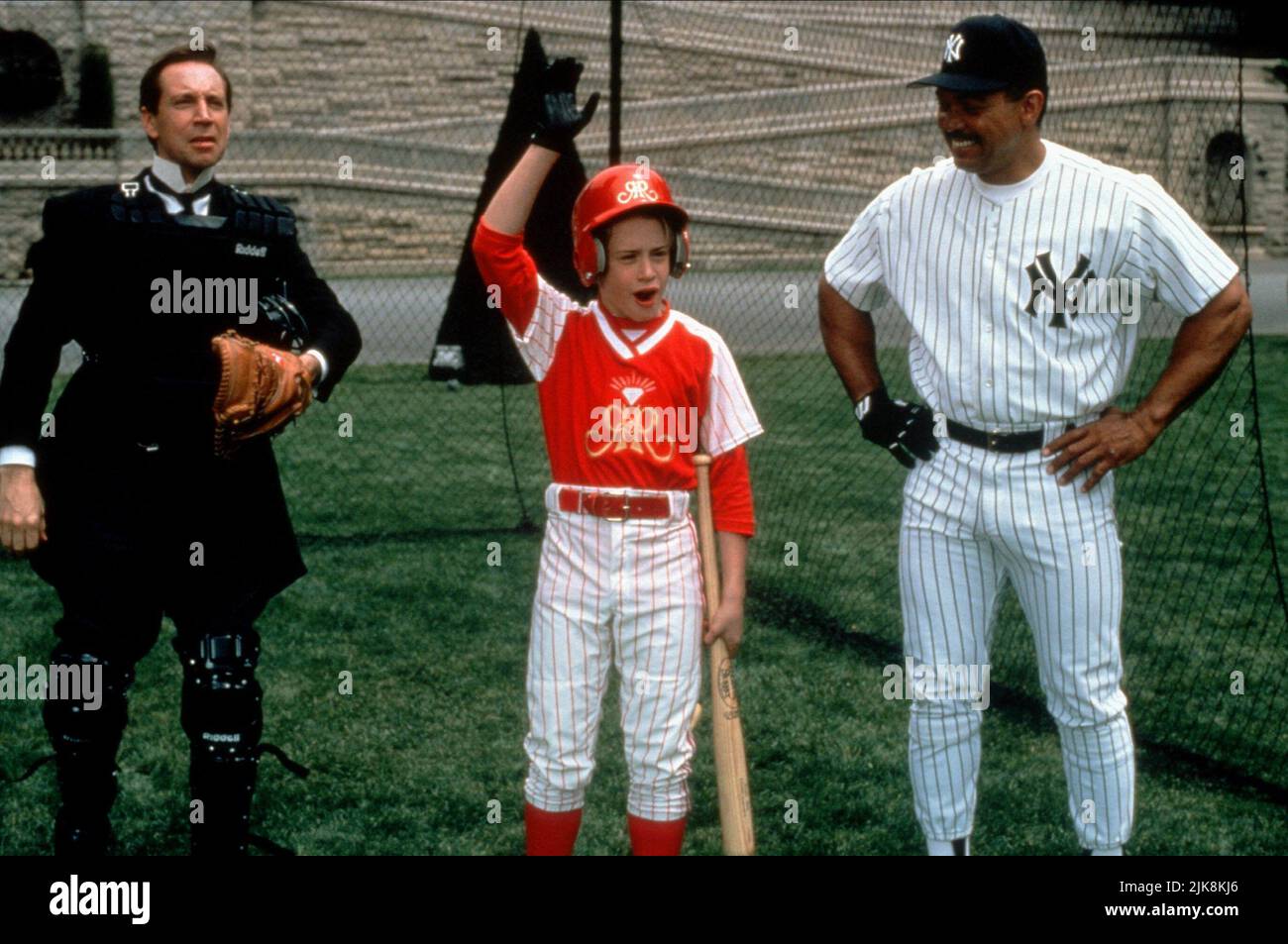 Jonathan Hyde, Macaulay Culkin, Reggie Jackson Film: Richie Rich (1994) Characters: Herbert Arthur Runcible Cadbury,Richie Rich,Baseball Coach  Director: Donald Petrie 21 December 1994   **WARNING** This Photograph is for editorial use only and is the copyright of WARNER and/or the Photographer assigned by the Film or Production Company and can only be reproduced by publications in conjunction with the promotion of the above Film. A Mandatory Credit To WARNER is required. The Photographer should also be credited when known. No commercial use can be granted without written authority from the Fi Stock Photo
