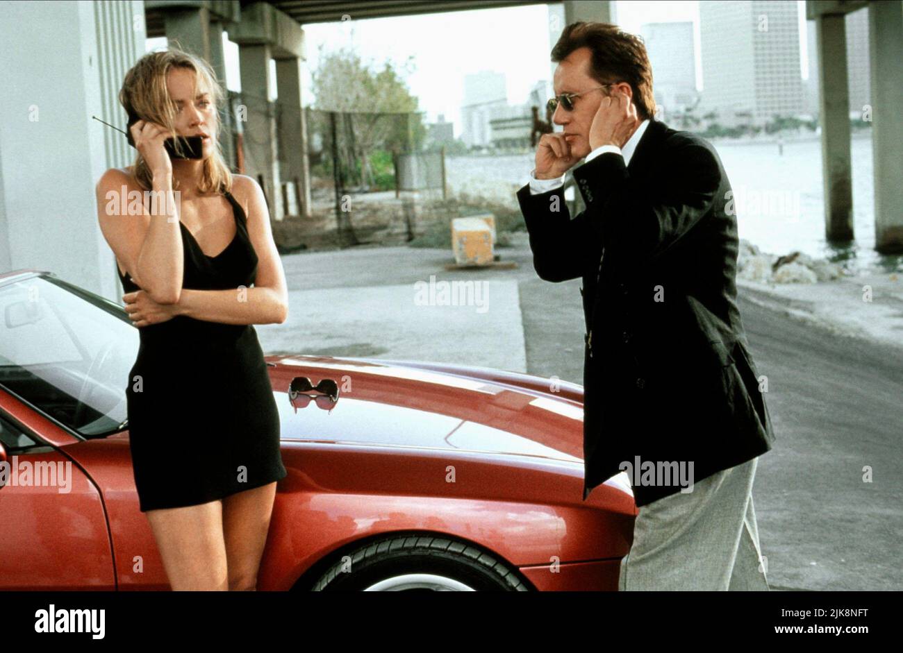 Sharon Stone & James Woods Film: The Specialist (1994) Characters: May Munro (aka Adrian Hastings) & Ned Trent  Director: Luis Llosa 07 October 1994   **WARNING** This Photograph is for editorial use only and is the copyright of WARNER BROS and/or the Photographer assigned by the Film or Production Company and can only be reproduced by publications in conjunction with the promotion of the above Film. A Mandatory Credit To WARNER BROS is required. The Photographer should also be credited when known. No commercial use can be granted without written authority from the Film Company. Stock Photo
