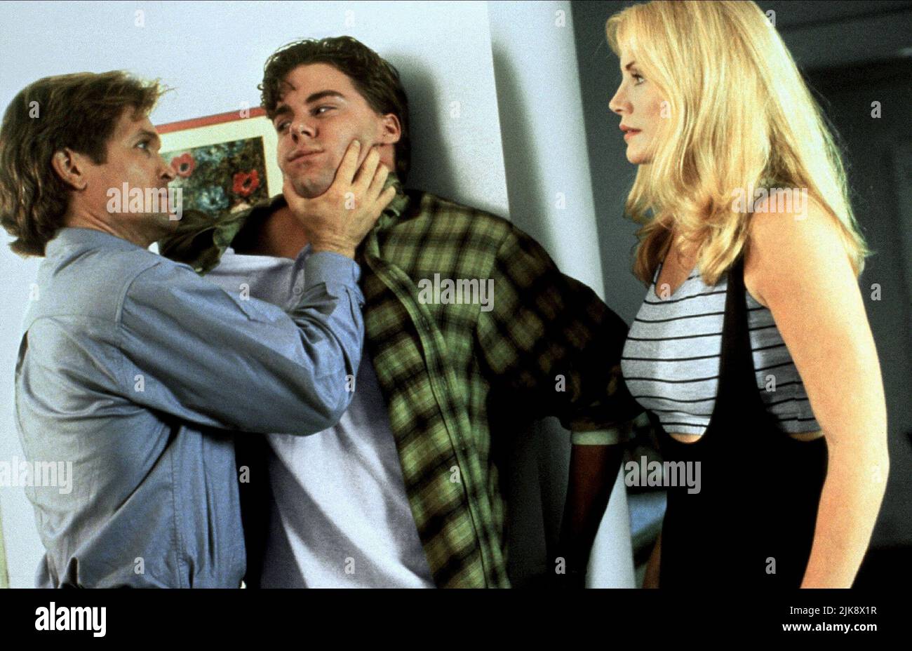 Andrew Stevens, Michael D Arenz, Shannon Tweed Film: A Woman Scorned; Scorned (USA/CAN 1994) Characters: Alex Weston,,Patricia Langley / Amanda Chessfield  Director: Andrew Stevens 13 July 1994   **WARNING** This Photograph is for editorial use only and is the copyright of PRISM PICTURES and/or the Photographer assigned by the Film or Production Company and can only be reproduced by publications in conjunction with the promotion of the above Film. A Mandatory Credit To PRISM PICTURES is required. The Photographer should also be credited when known. No commercial use can be granted without writ Stock Photo