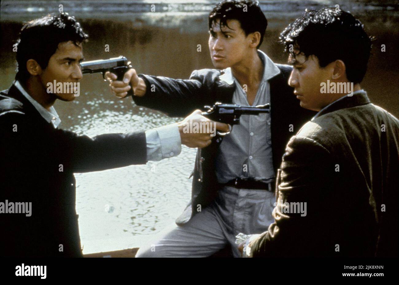 Waise Lee, Jacky Cheung & Tony Leung Film: Bullet In The Head (Dip huet gaai tau) Characters: Paul / Little Wing,Frank / Fai &  Hk 1990, Director: John Woo 17 August 1990   **WARNING** This Photograph is for editorial use only and is the copyright of JOHN WOO FILM PRODUCTION and/or the Photographer assigned by the Film or Production Company and can only be reproduced by publications in conjunction with the promotion of the above Film. A Mandatory Credit To JOHN WOO FILM PRODUCTION is required. The Photographer should also be credited when known. No commercial use can be granted without written Stock Photo