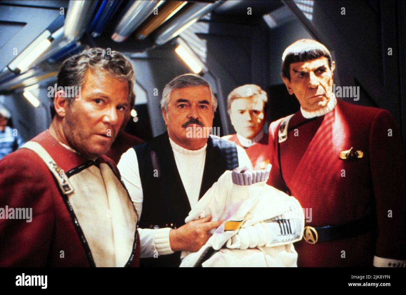 William Shatner, James Doohan, Walter Koenig & Leonard Nimoy Film: Star Trek Vi: The Undiscovered Country (USA 1989) Characters: CAPTAIN JAMES T. KIRK, CAPTAIN MONTGOMERY  Director: Nicholas Meyer 03 December 1991   **WARNING** This Photograph is for editorial use only and is the copyright of PARAMOUNT PICTURES and/or the Photographer assigned by the Film or Production Company and can only be reproduced by publications in conjunction with the promotion of the above Film. A Mandatory Credit To PARAMOUNT PICTURES is required. The Photographer should also be credited when known. No commercial use Stock Photo