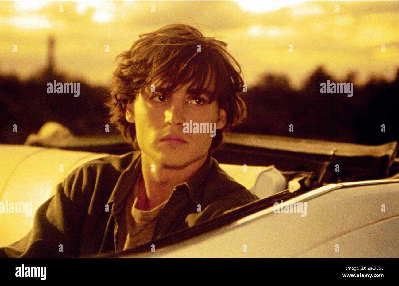 Johnny Depp Film: Arizona Dream (USA/FR 1992) Characters: Axel Blackmar  Director: Emir Kusturica 26 October 1992   **WARNING** This Photograph is for editorial use only and is the copyright of WARNER BROS. and/or the Photographer assigned by the Film or Production Company and can only be reproduced by publications in conjunction with the promotion of the above Film. A Mandatory Credit To WARNER BROS. is required. The Photographer should also be credited when known. No commercial use can be granted without written authority from the Film Company. Stock Photo