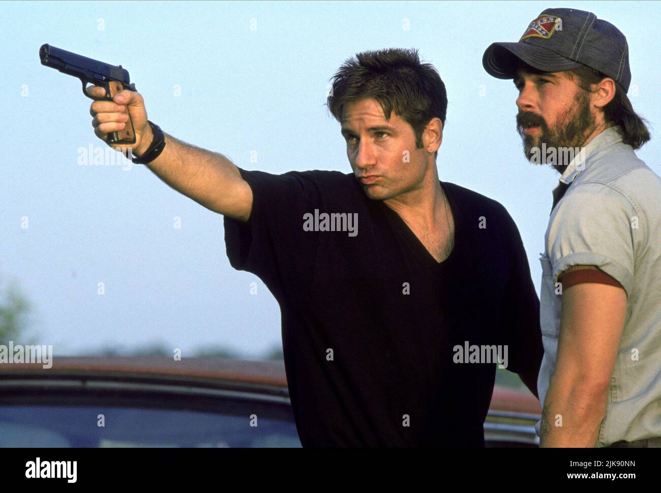 David Duchovny & Brad Pitt Film: Kalifornia (USA 1993) Characters: Brian Kessler, Early Grayce  Director: Dominic Sena 03 September 1993   **WARNING** This Photograph is for editorial use only and is the copyright of PROPAGANDA FILMS and/or the Photographer assigned by the Film or Production Company and can only be reproduced by publications in conjunction with the promotion of the above Film. A Mandatory Credit To PROPAGANDA FILMS is required. The Photographer should also be credited when known. No commercial use can be granted without written authority from the Film Company. Stock Photo