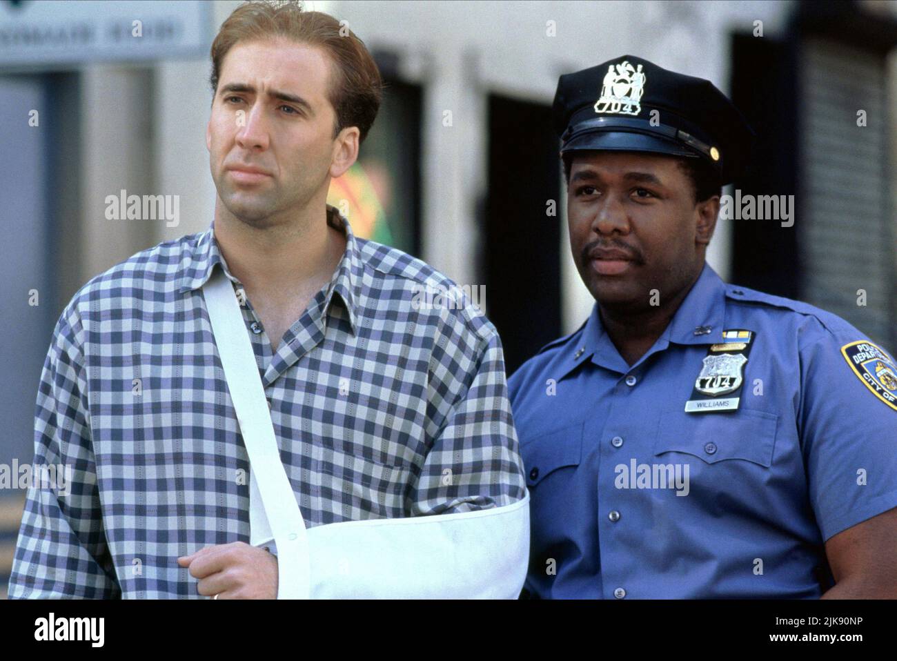 Nicolas Cage & Wendell Pierce Film: It Could Happen To You (1990) Characters: Charlie Lang, Bo Williams  Director: Andrew Bergman 29 July 1994   **WARNING** This Photograph is for editorial use only and is the copyright of TRISTAR and/or the Photographer assigned by the Film or Production Company and can only be reproduced by publications in conjunction with the promotion of the above Film. A Mandatory Credit To TRISTAR is required. The Photographer should also be credited when known. No commercial use can be granted without written authority from the Film Company. Stock Photo