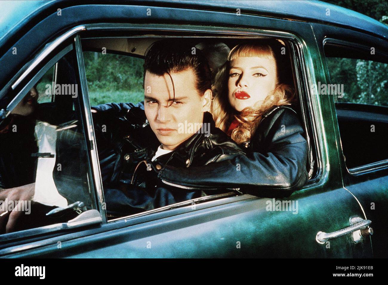 Johnny Depp & Traci Lords Film: Cry Baby (1990) Characters: Wade 'Cry-Baby' Walker, Wanda Woodward  Director: John Waters 06 April 1990   **WARNING** This Photograph is for editorial use only and is the copyright of UNIVERSAL and/or the Photographer assigned by the Film or Production Company and can only be reproduced by publications in conjunction with the promotion of the above Film. A Mandatory Credit To UNIVERSAL is required. The Photographer should also be credited when known. No commercial use can be granted without written authority from the Film Company. Stock Photo