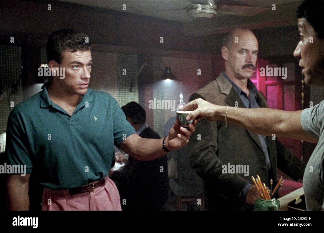 Jean-Claude Van Damme & Geoffrey Lewis Film: Double Impact (1991) Characters: Alex, Frank Avery  Director: Sheldon Lettich 09 August 1991   **WARNING** This Photograph is for editorial use only and is the copyright of COLUMBIA and/or the Photographer assigned by the Film or Production Company and can only be reproduced by publications in conjunction with the promotion of the above Film. A Mandatory Credit To COLUMBIA is required. The Photographer should also be credited when known. No commercial use can be granted without written authority from the Film Company. Stock Photo